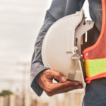 worker holding hard hat