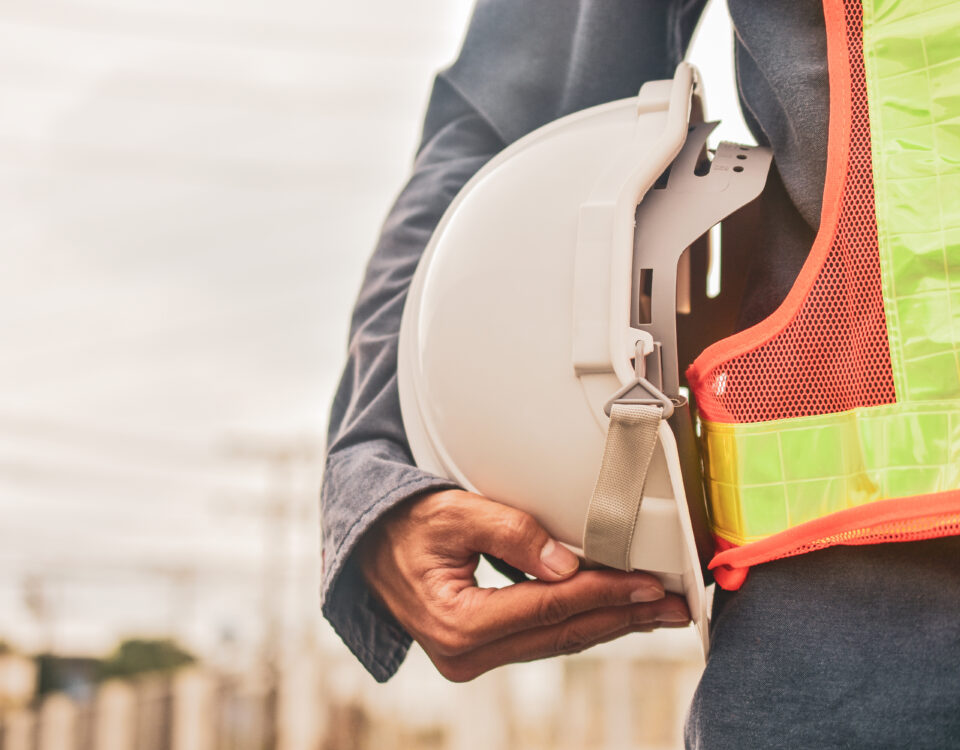 worker holding hard hat