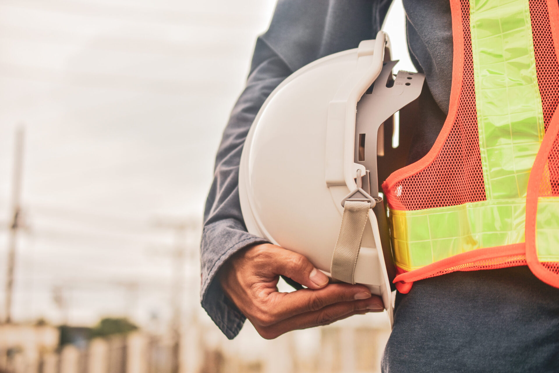 worker holding hard hat